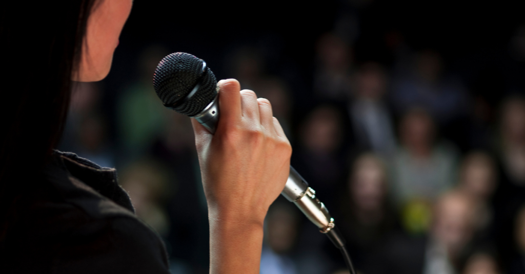 person holding microphone